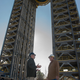 NASA engineers Robert Bobo (left) and Mike Nichols (right) talk beneath the 221-foot-tall Test Stand 4693. (Image: NASA/MSFC/Emmett Given)